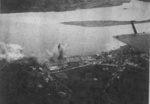 Rising Sun Petroleum Company facilities and nearby military seaplane base at Tamsui, Taiwan under attack by aircraft from USS Intrepid, 12 Oct 1944, photo 2 of 3