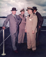 President Eisenhower, Admiral Burke, and Presidential Naval Aide Captain Evan P. Aurand aboard USS Saratoga, 6 Jun 1957