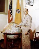 Brigadier General Doolittle posing with a globe, circa 1942