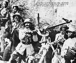 Emperor Haile Selassie I of Ethiopia posing with an anti-aircraft gun at Battle of Maychew, Ethiopia, 31 Mar 1936