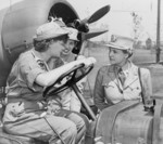 Colonel Oveta Hobby (right) speaking with Auxiliary Margaret Peterson and Captain Elizabeth Gilbert at Mitchel Field, New York, United States, 1943