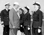 US Secretary of the Navy Frank Knox inspecting WAVES officers Ensign Mary Cave (center of photograph), Ensign Margaret Campbell (speaking to Knox), and Ensign Bertha Shoves (right of photograph), accompanied by station commanding officer Captain Henry Gearing, Naval Training Station, San Diego, California, United States, Jun 1943