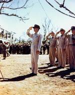 MacArthur saluted as the US National Anthem was played, Philippines, 1 Aug 1945