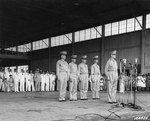 Douglas MacArthur at the induction ceremony of Philippine Army Air Corps, Zablan Field, Camp Murphy, Rizal, Philippine Islands, 15 Aug 1941; behind MacArthur, left to right: Richard Sutherland, Harold George, William Marquat, LeGrande Diller