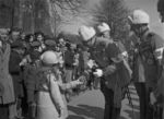 Field Marshal Carl Gustaf Emil Mannerheim being greeted by Finnish girls at the 20th anniversary celebration of the libration of Viipuri, Finland, 1938; note old Viipuri Cathedral in background, which would be destroyed by Soviet bombing in 1940