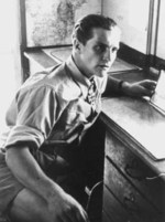 Hans-Joachim Marseille sitting at a desk, circa 1940s