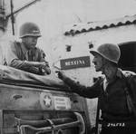 George Patton and Lieutenant Colonel Lyle Bernard, CO, 30th Infantry Regiment discussing strategy near Brolo, Sicily, Italy, circa Jul-Aug 1943