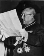 Manchukuo Prime Minister Zhang Jinghui reading a document, date unknown