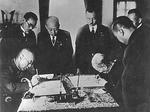 Manchukuo Prime Minister Zheng Xiaoxu and Japanese Ambassador Nobuyoshi Muto signing the Japan-Manchukuo Protocol, Xinjing, Manchukuo (now Changchun, China), 15 Sep 1932