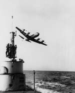 P3V aircraft flying over USS Capitaine, summer 1960