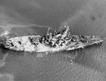 USS Indiana off Norfolk, Virginia, United States, 8 Sep 1942, photo 1 of 5; note No. 1 and No. 3 turrets turned to starboard