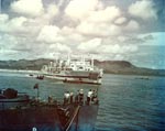Hospital ship Tranquillity arrived at Guam with survivors of Indianapolis, 8 Aug 1945, photo 1 of 3; destroyer escort Steele in foreground