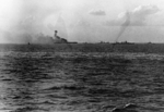 USS Lexington burning as she was being abandoned, 8 May 1942, photo 2 of 2; note USS Chester and other warships nearby