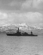 Louisville steamed out of Kulak Bay, Adak, Aleutian Islands, bound for operations against Attu, 25 Apr 1943; note Sweepers Cove in background