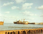 Liberty Ship IX-229 Inca/IX-227 Gamage and LST-823 aground and stripped in Buckner Bay, Okinawa, late 1940s