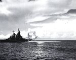 Missouri firing full salvo from both forward 16-inch gun turrets during shakedown exercise, Aug 1944; note six super-sonic projectiles at upper right; as seen on page 23 of US Navy War Photographs