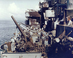 Crew of USS Nashville inspecting the damage caused by a special attack aircraft, Dec 1944