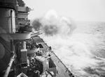 HMS Rodney firing her primary weapons in exercise, western Mediterranean Sea, Apr 1943