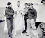 Crew of USS Spencer cared for rescued U-175 sailors, North Atlantic, 500 nautical miles WSW of Ireland, 17 Apr 1943, photo 1 of 2