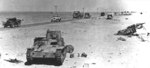 Italian M11/39 tank and other vehicles in North Africa, circa early 1940s