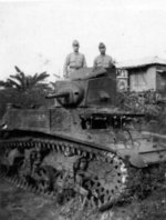 Three Japanese soldiers posing with a captured American M3 light tank, near Manila, Philippine Islands, Jan 1942; note the face of one Japanese soldier showing through the driver