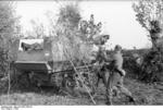 German soldiers camouflaging a Marder I tank destroyer, southern France, 1942