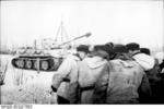 German tank commanders meeting in the field, Russia, Jan-Feb 1944; note winter-camouflaged Tiger I heavy tank in background