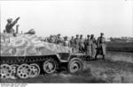 Field Marshal Rundstedt visiting troops of the German 12th SS Panzer Division Hitlerjugend, Northern France, Jan 1944, photo 3 of 3; note SdKfz. 251 halftrack vehicle