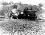 Tractor of 196th Field Artillery of US 8th Army towing a 155 mm Howitzer M1 at Tari-Gol, Korea, 8 Apr 1951