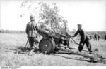 German soldiers camouflaging a 15 cm NbW 41 rocket launcher, Soviet Union, fall 1943