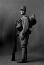 Portrait of a Japanese Army soldier with Type 38 rifle and other gear, circa 1940s