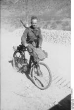 German soldier with bicycle and Gewehr 41 rifle, Balkan Peninsula, 1941