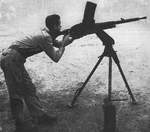 US servicemen testing a captured Japanese 13mm heavy machine gun, circa 1940s