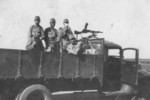Japanese troops on a truck, 1942-1945; note captured Madsen machine gun