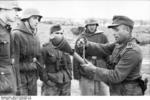 German non-commissioned officer demonstrating the Panzerfaust weapon, Russia, Sep 1943, photo 1 of 2