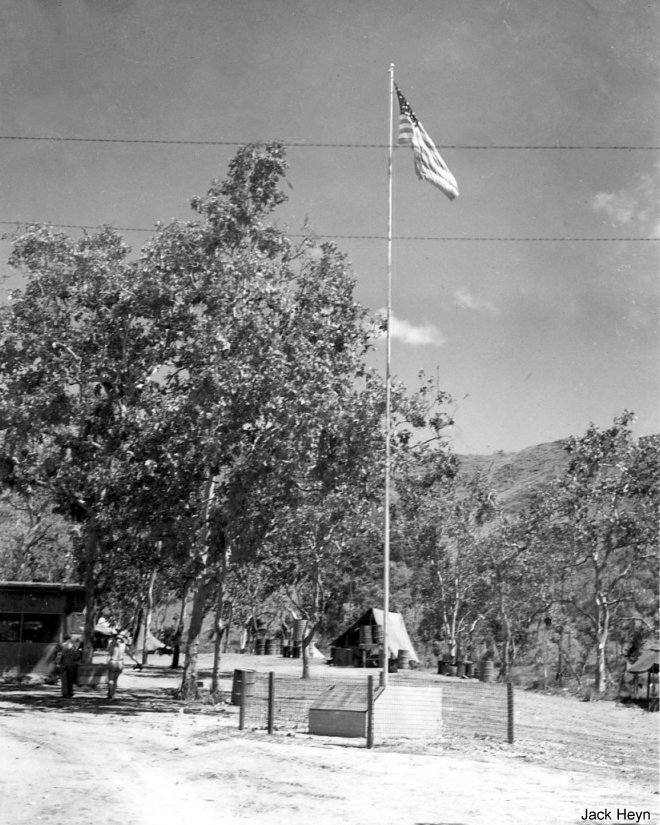 Flagpole by the orderly room at an airfield at Port Moresby, Australian Papua, 1943