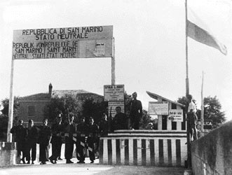 A checkpoint on the border of San Marino, 1940s; note sign in Italian, German, and French noting the country's neutrality