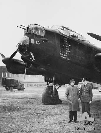 Prime Minister John Curtin and Captain Hugh Edwards before Lancaster bomber 'G for George' at RAF Binbrook, Lincolnshire, England, United Kingdom, circa May 1944