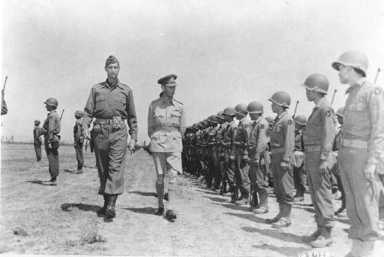 King George VI of the United Kingdom inspecting Japanese-American troops of US 442nd Regimental Combat Team, Cecina area, Italy, date unknown
