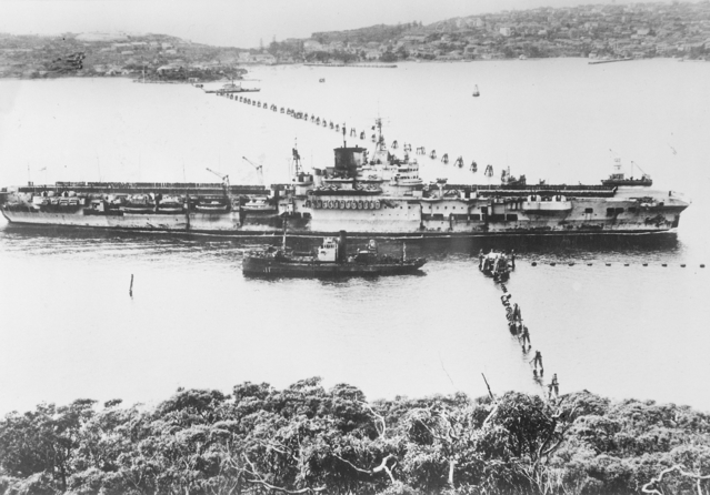 HMS Formidable going through the anti-submarine boom in Sydney harbor, Australia, mid-1945; photo taken from George's Head looking toward Green Point