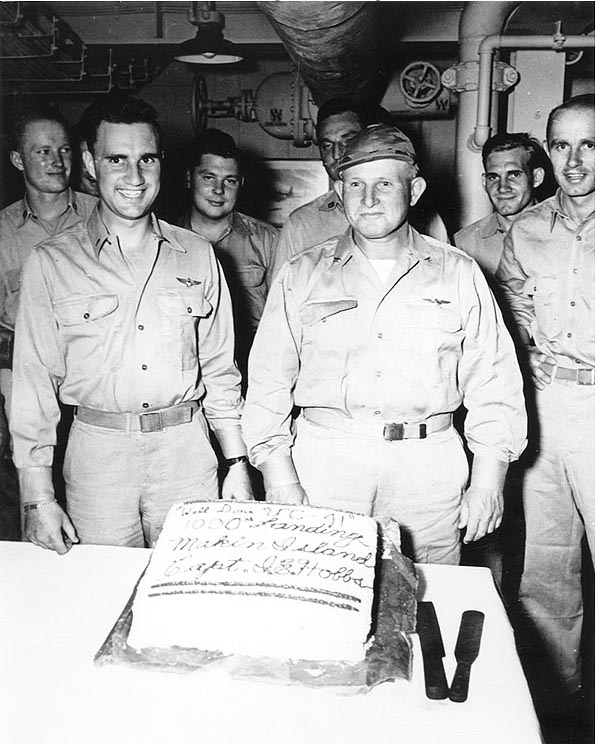 Captain Ira E. Hobbs, USS Makin Island's Commanding Officer, honored aviators of Composite Squadron 41 on the occasion of their 1,000th landing on board, mid-1945