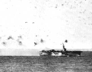 USS Steamer Bay under attack near the Philippine Islands, 5 Jan 1945; note special attack aircraft flying past her stern