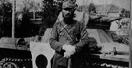 Japanese officer standing in front of a captured German-built Chinese Army Panzer I tank, China, circa late 1930s