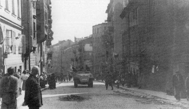 Polish resistance fighters with captured German SdKfz. 251 halftrack vehicle, Tamka Street, Warsaw, Poland, 14 Aug 1944, photo 1 of 3
