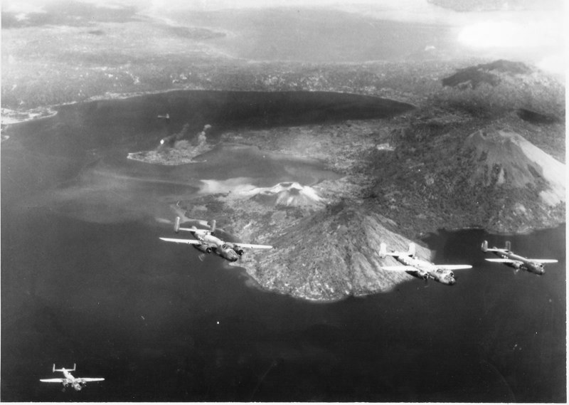 PBJ-1 Mitchell bombers of Marine Squadron VMB-433 depart Rabaul, New Britain, after a raid 4 July 1945.