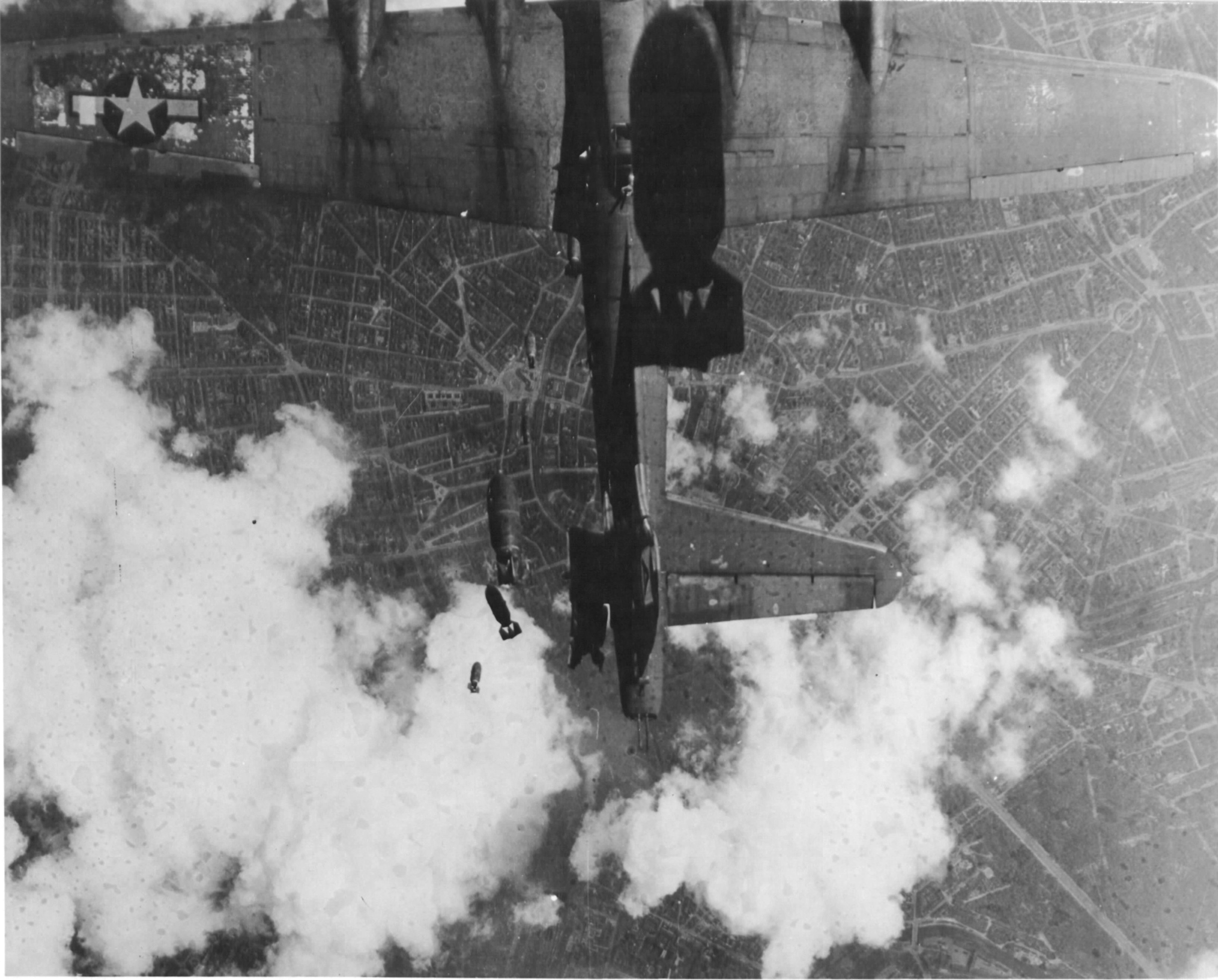 B-17G Fortress 'Miss Donna Mae II' drifted under another bomber on a bomb run over Berlin, 19 May 1944. A 1,000 lb bomb from above tore off the left stabilizer and sent the plane into an uncontrollable spin. All 11 were killed. Photo 2 of 4