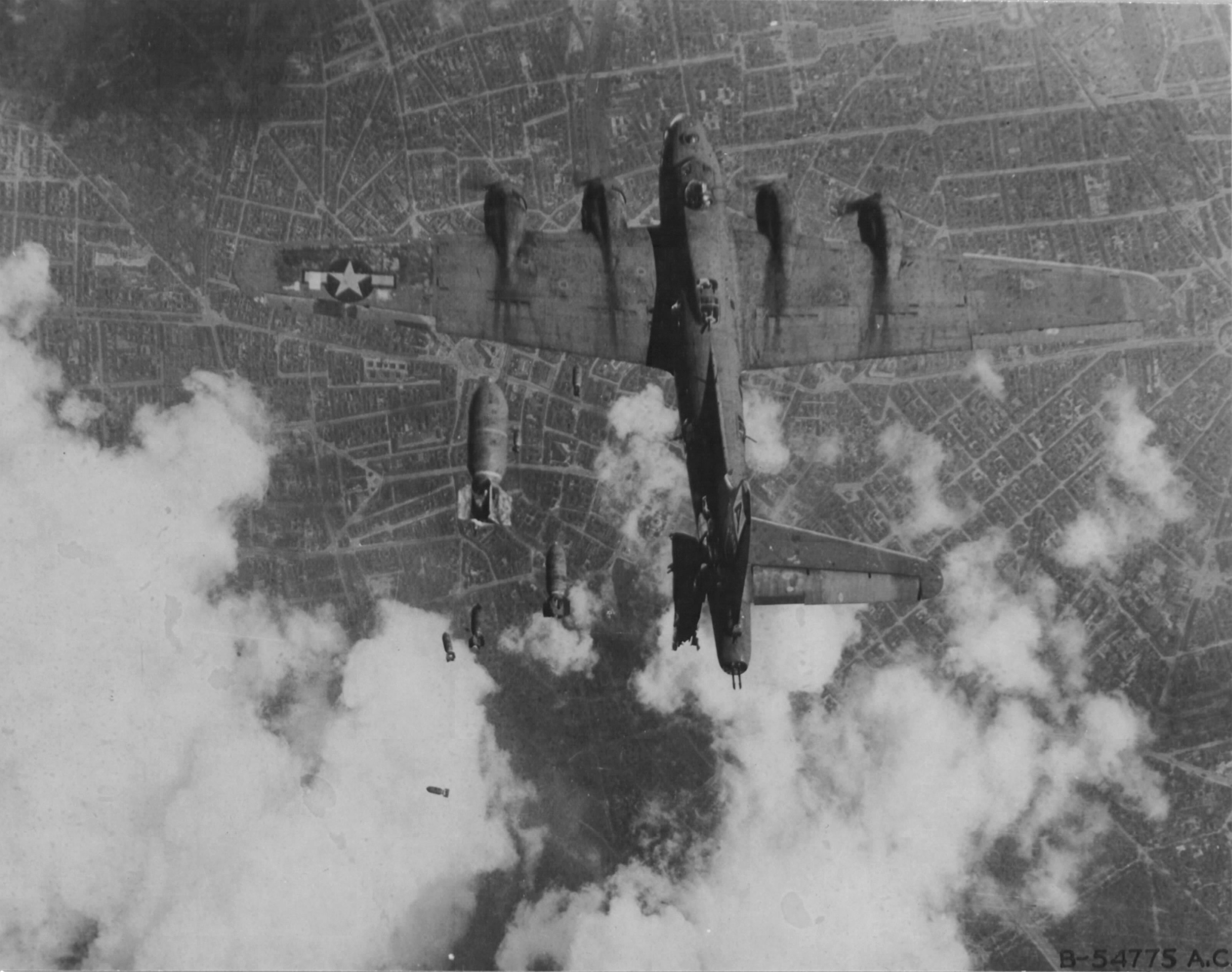 B-17G Fortress 'Miss Donna Mae II' drifted under another bomber on a bomb run over Berlin, 19 May 1944. A 1,000 lb bomb from above tore off the left stabilizer and sent the plane into an uncontrollable spin. All 11 were killed. Photo 3 of 4