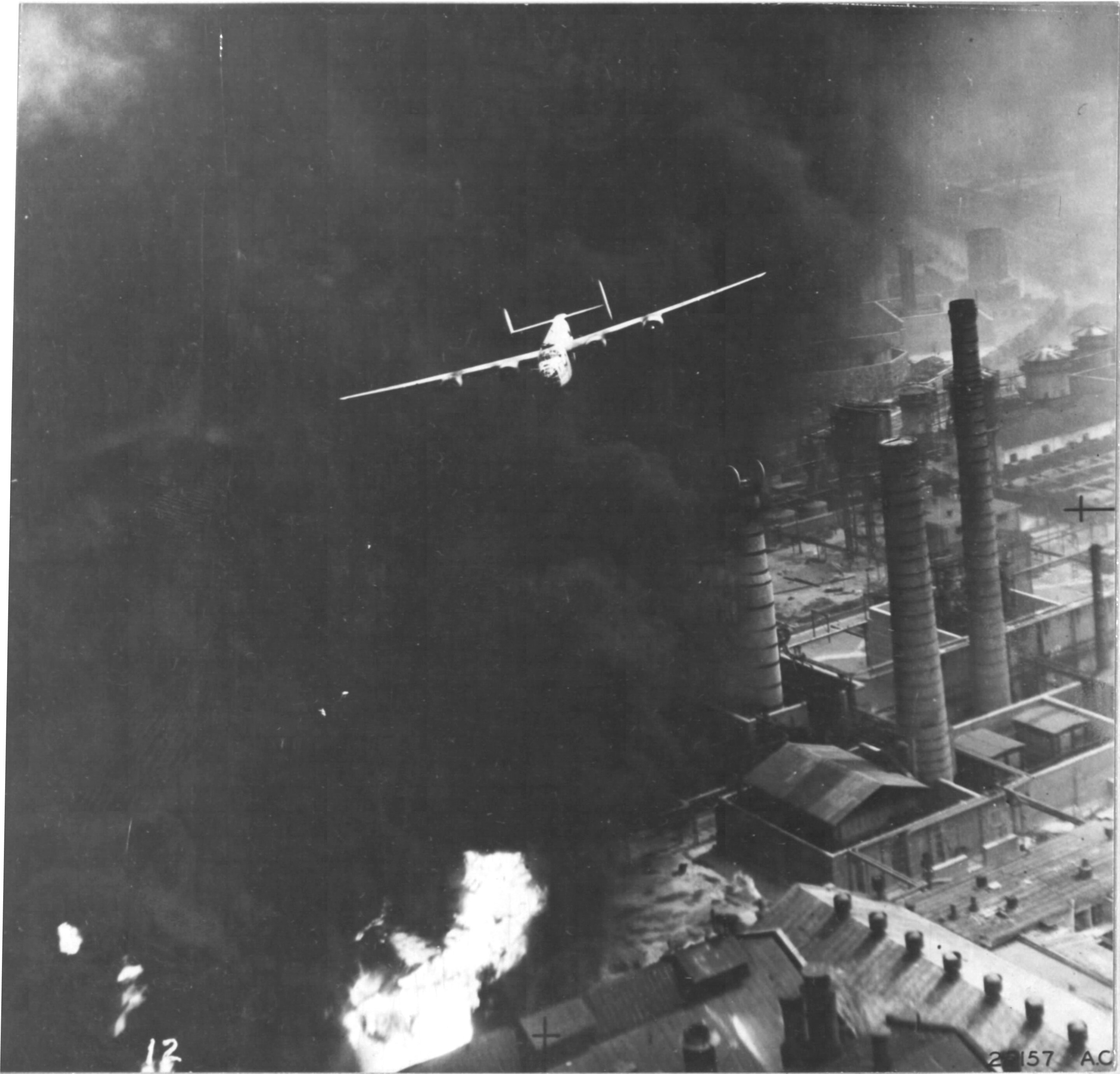 B-24D Liberator “The Sandman” of the 345th Bomb Squadron over the burning Astra Romania oil refinery in Ploesti, Romania during Operation Tidal Wave, Aug 1 1943.