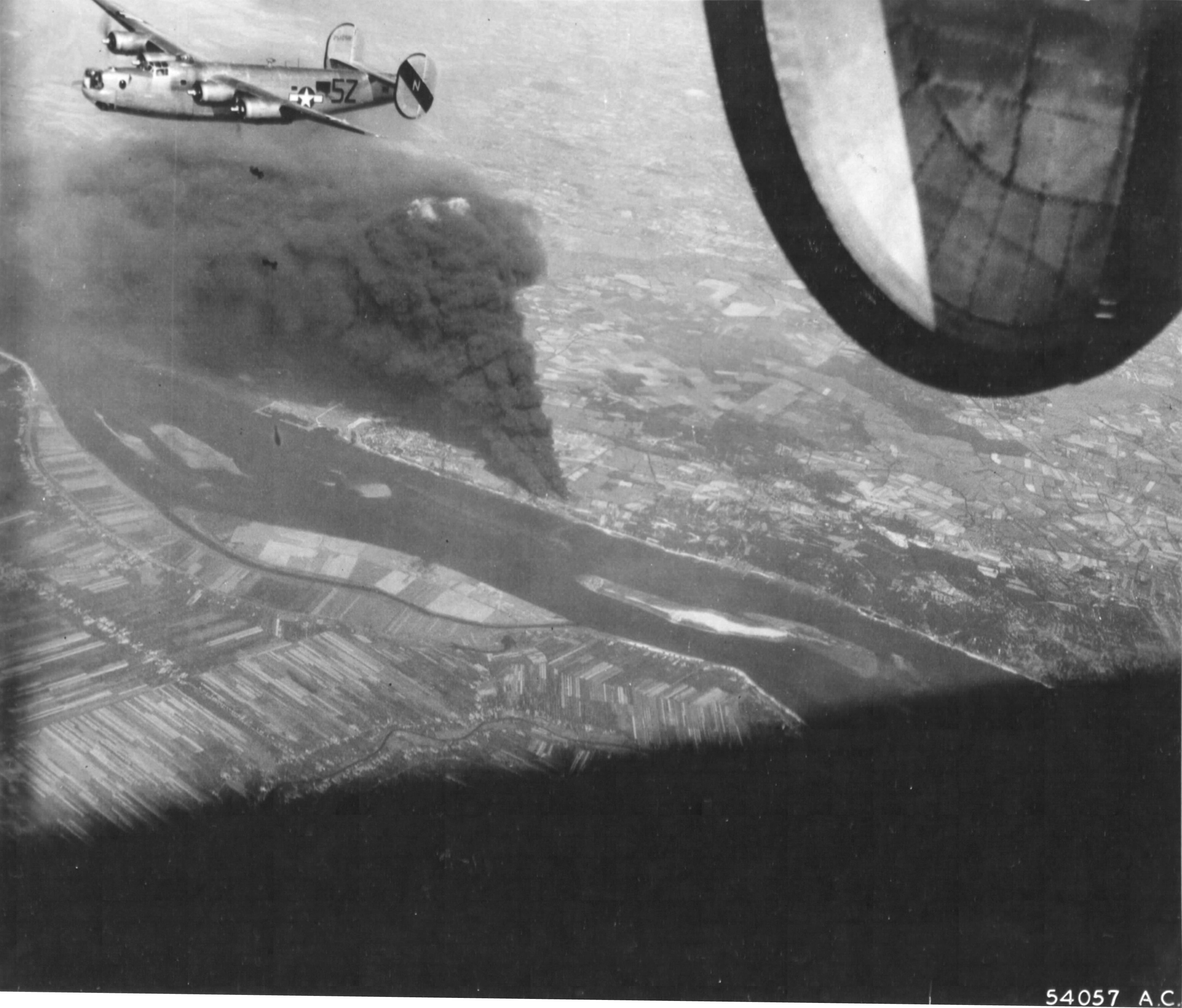 B-24J Liberator of the 856th Bomb Squadron over the target of the Rhenania-Ossag oil refinery near Hamburg, Germany, Aug 6 1944.