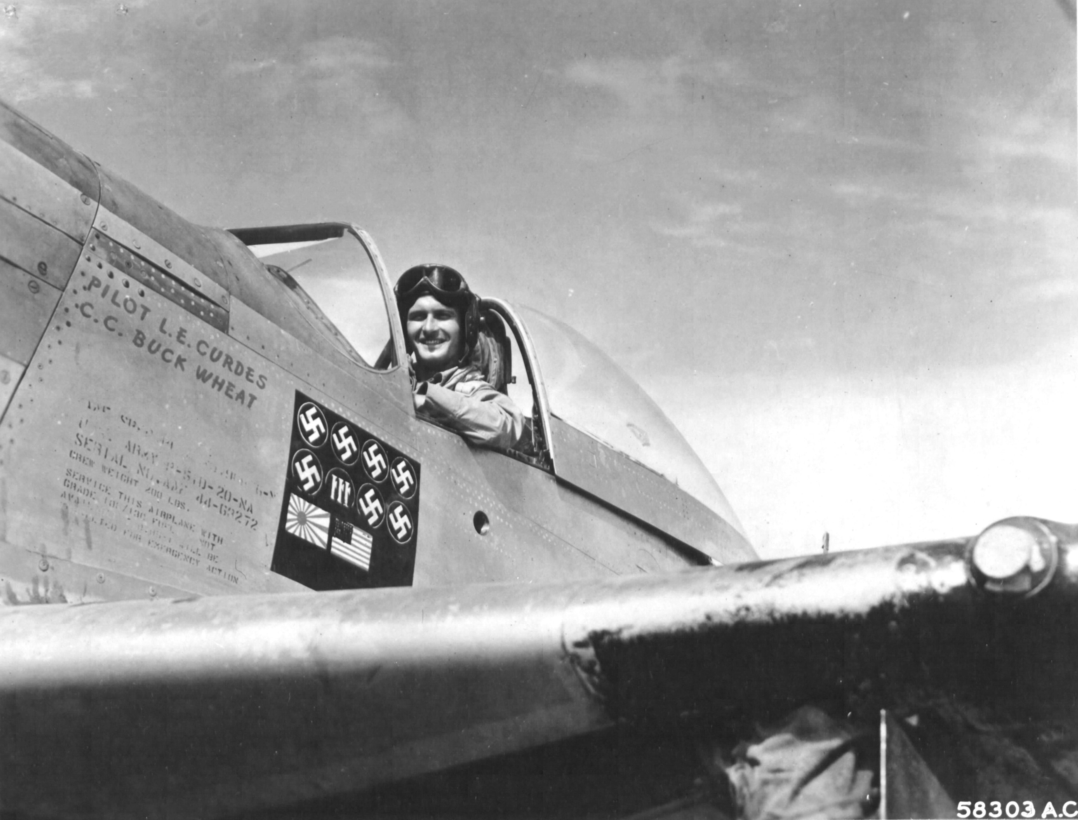 Capt Louis Curdes of the 4th Fighter Squadron and his P-51D Mustang “Bad Angel”. Note the interesting scoreboard. See Comment.